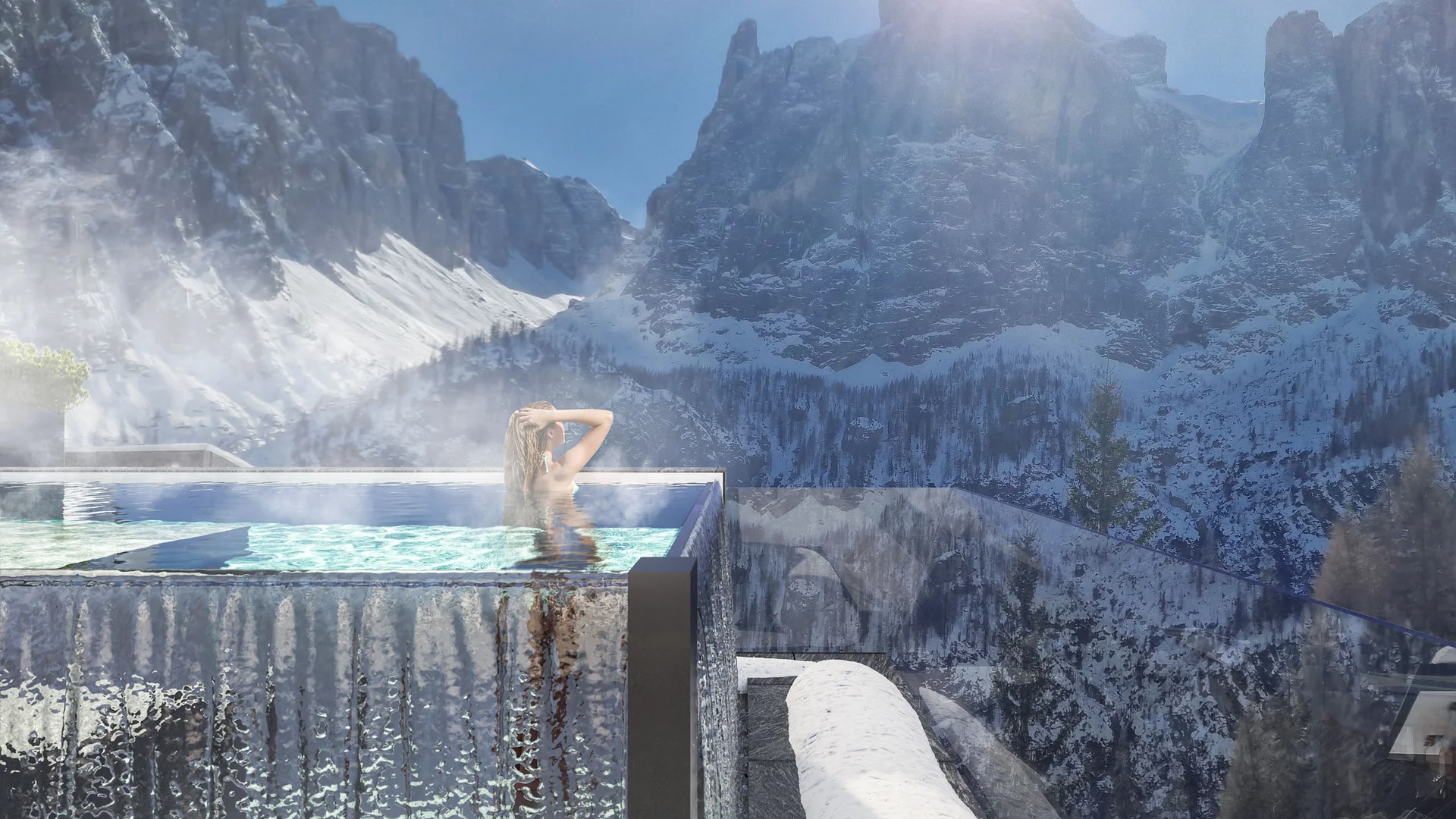Genuss und Wellness im Nature Hotel Delta in Alta Badia Frau entspannt im beheizten Außenpool mit Bergblick und Sonnenschein